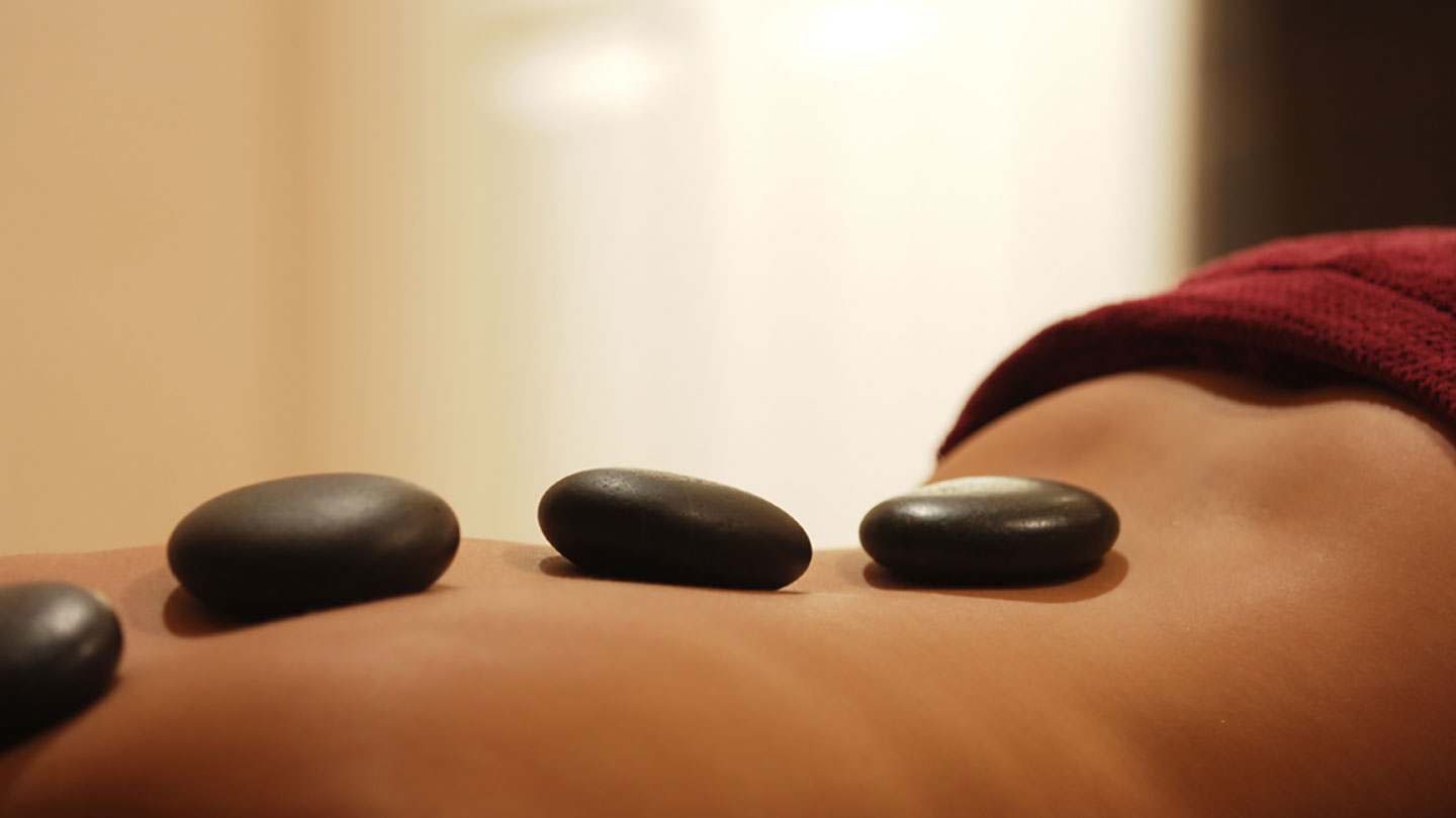 The benefits of hot stone massage therapy - Prana Endura